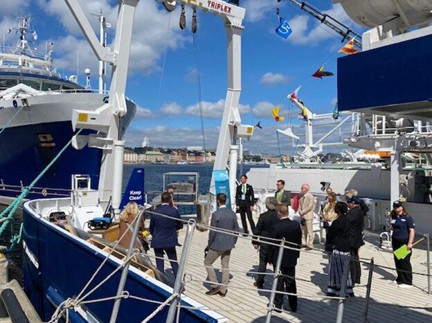 Specially invited guests are guided onboard R/V Skagerak during 'Open Ship' in Stockholm in June 2022. Visitors were shown autonomous platforms, including the Sailbuoy and the Seacat.